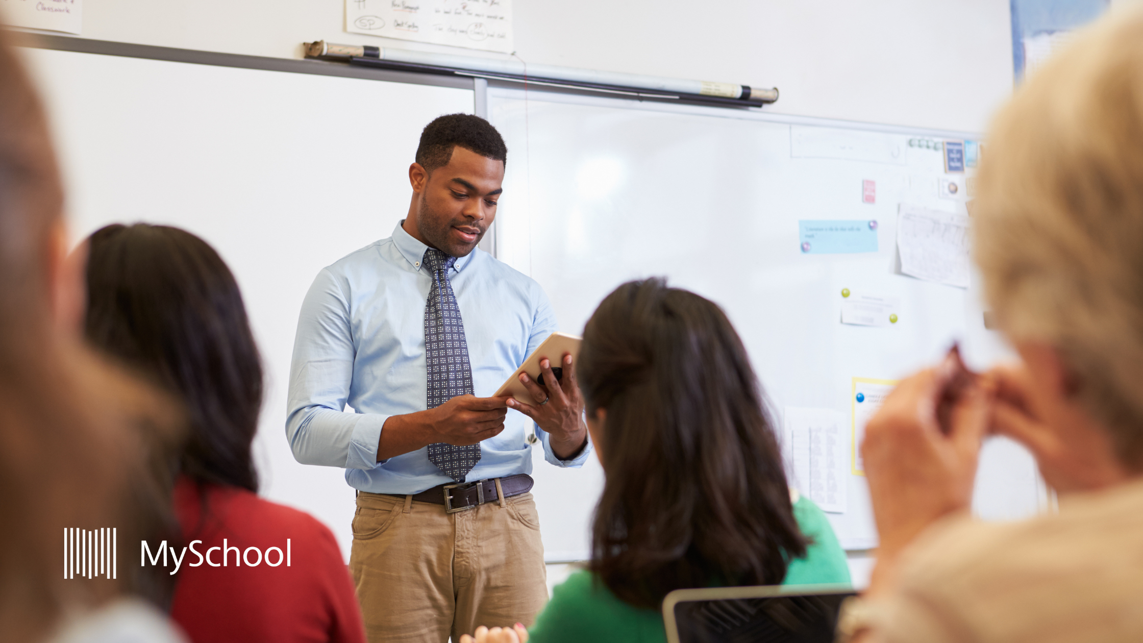 Teacher presenting to colleagues in a school professional development session