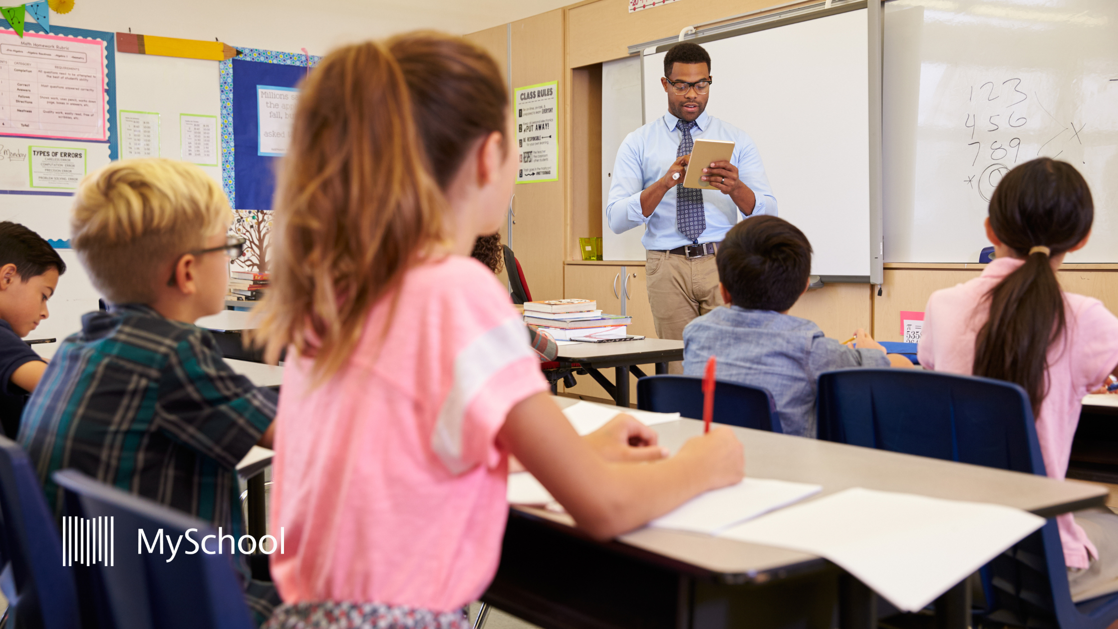 Teacher managing a class of primary school students