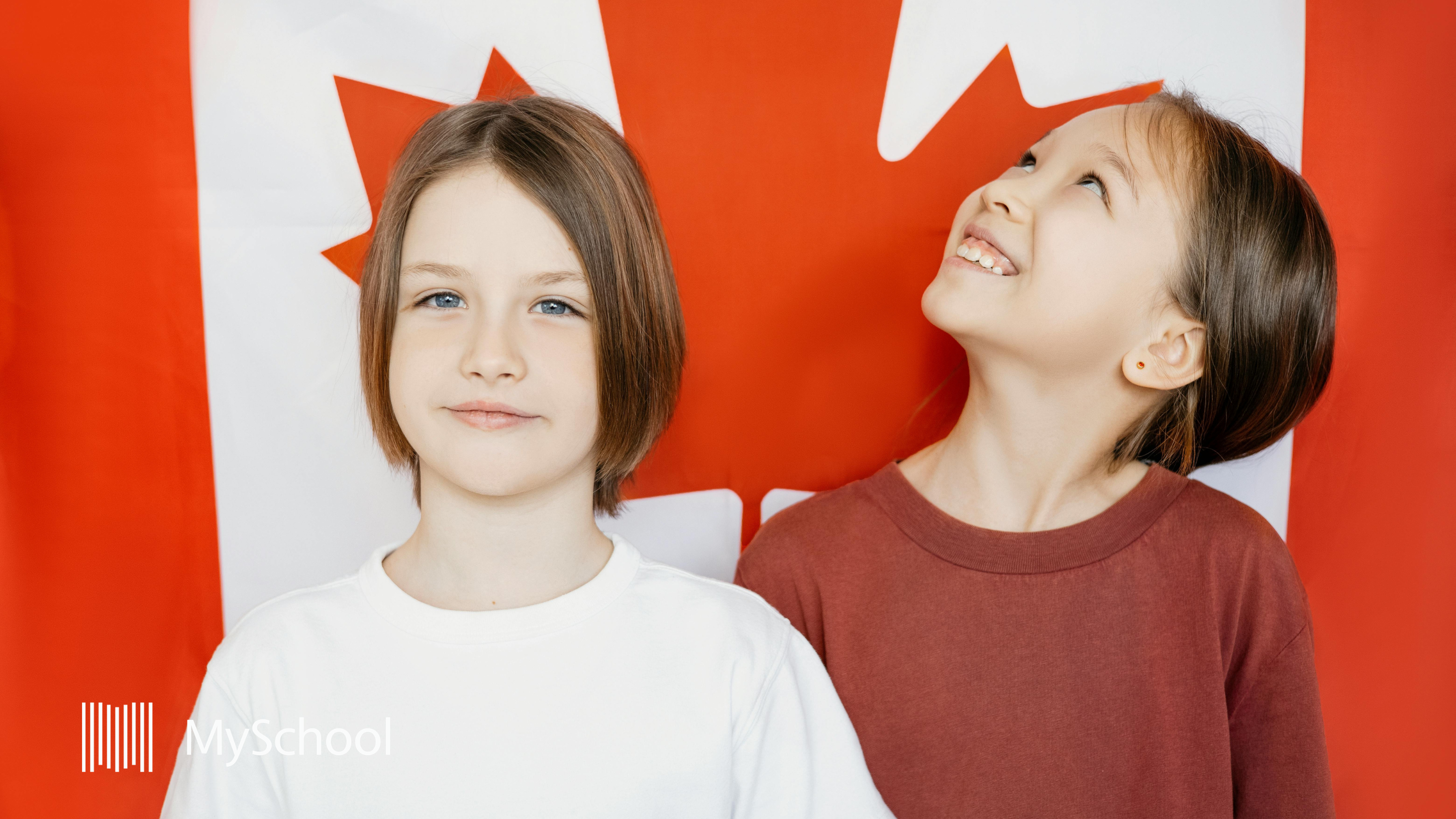 two k12 independent school pupils with Canadian flag