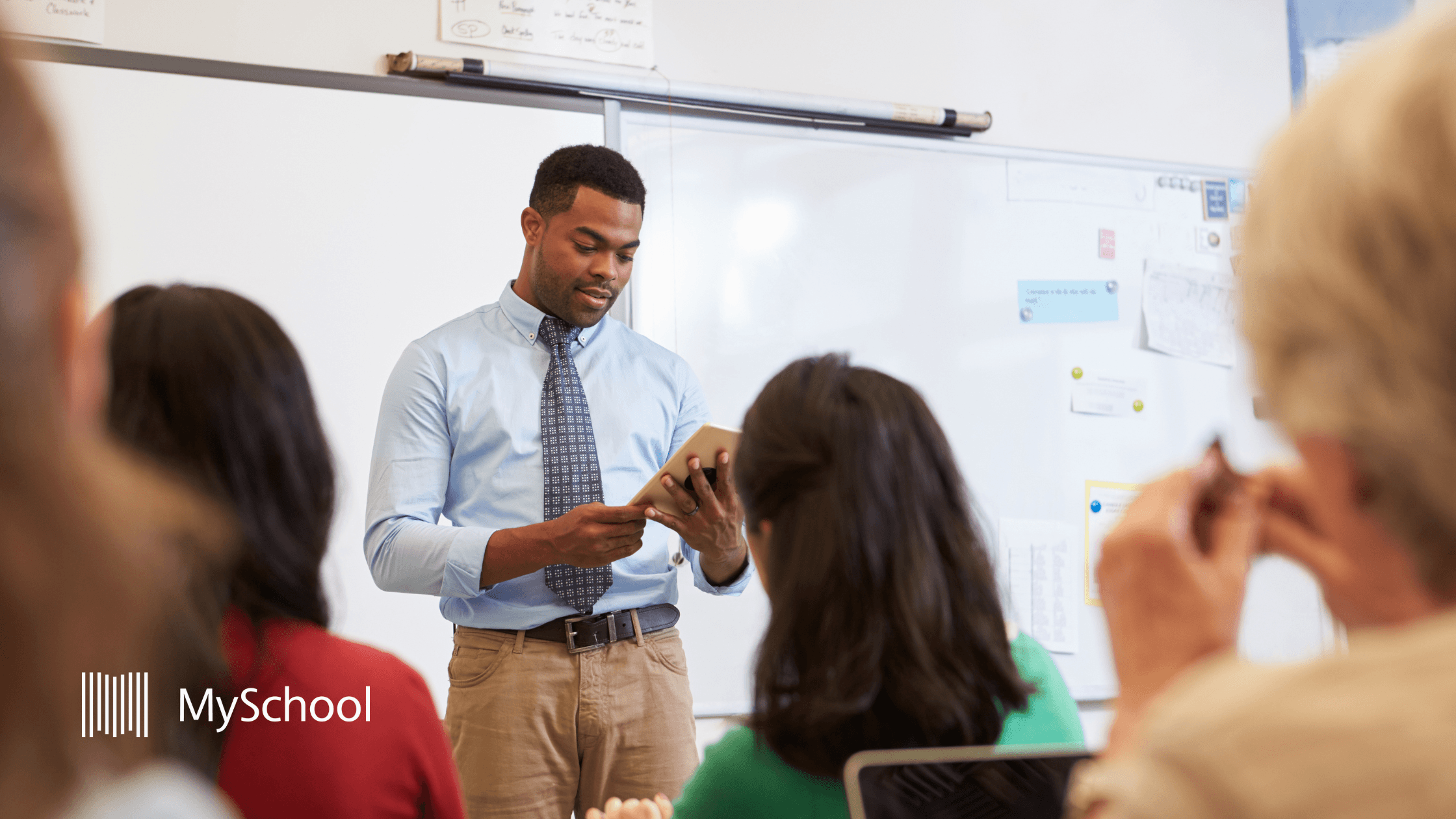 Teacher presenting to colleagues in a school professional development session