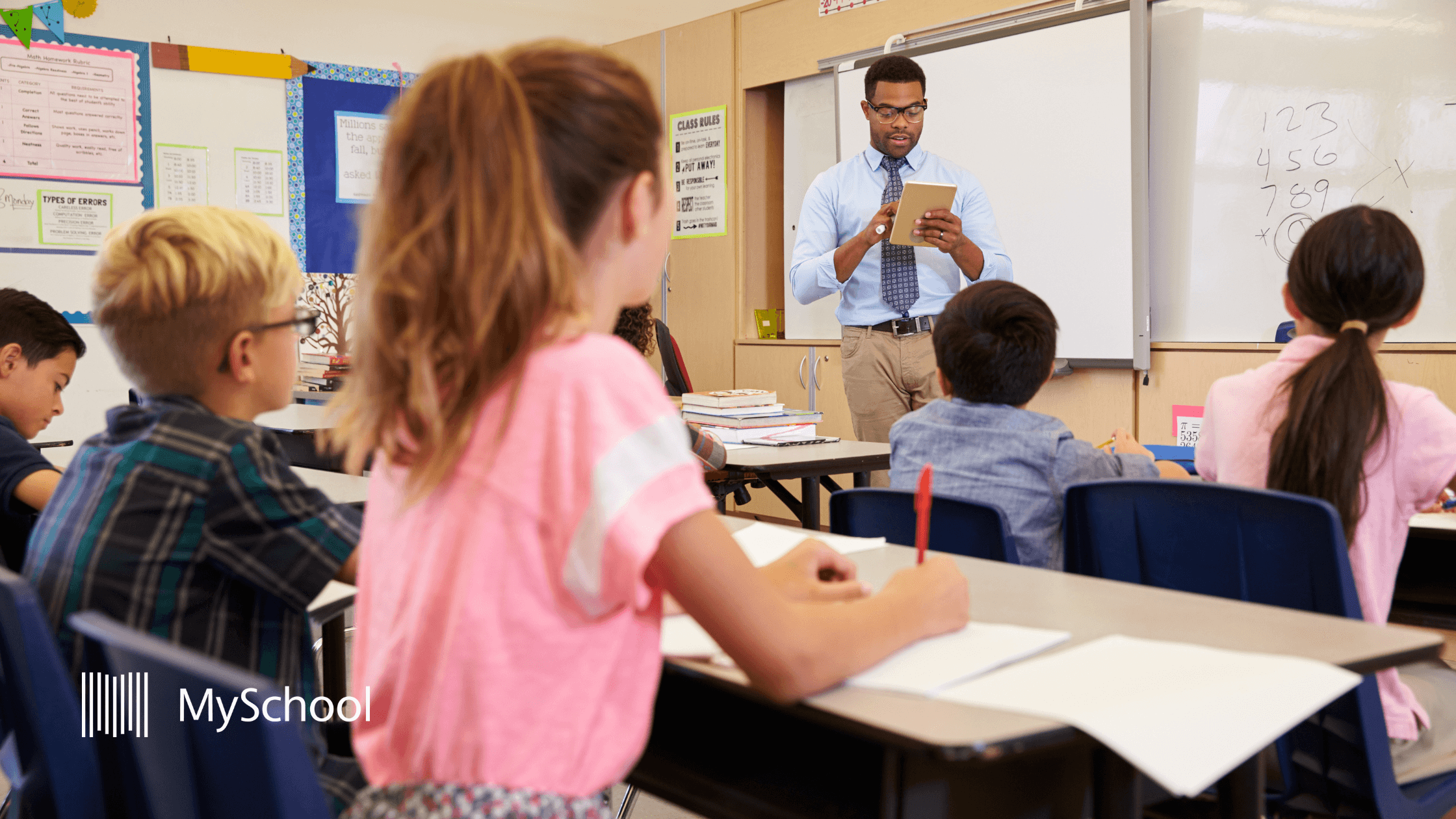 Teacher managing a class of primary school students