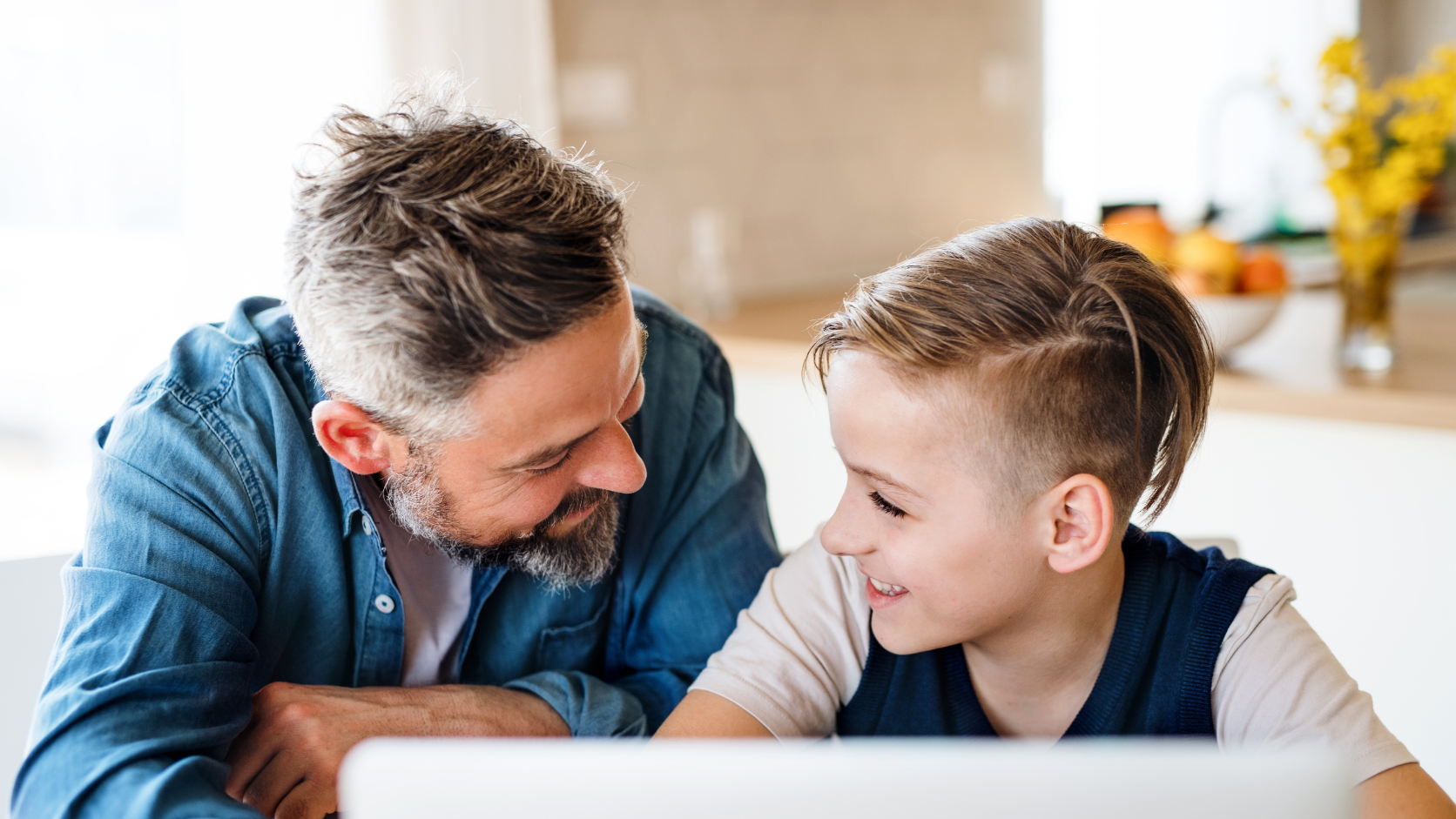 Father and son accessing school announcements and updates on MySchool family portal