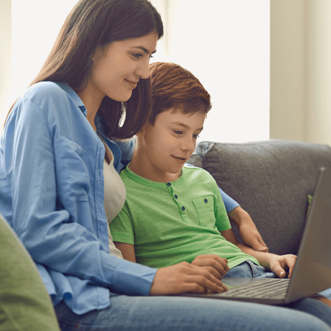 Parent and child completing K-12 school admission application online with MySchool