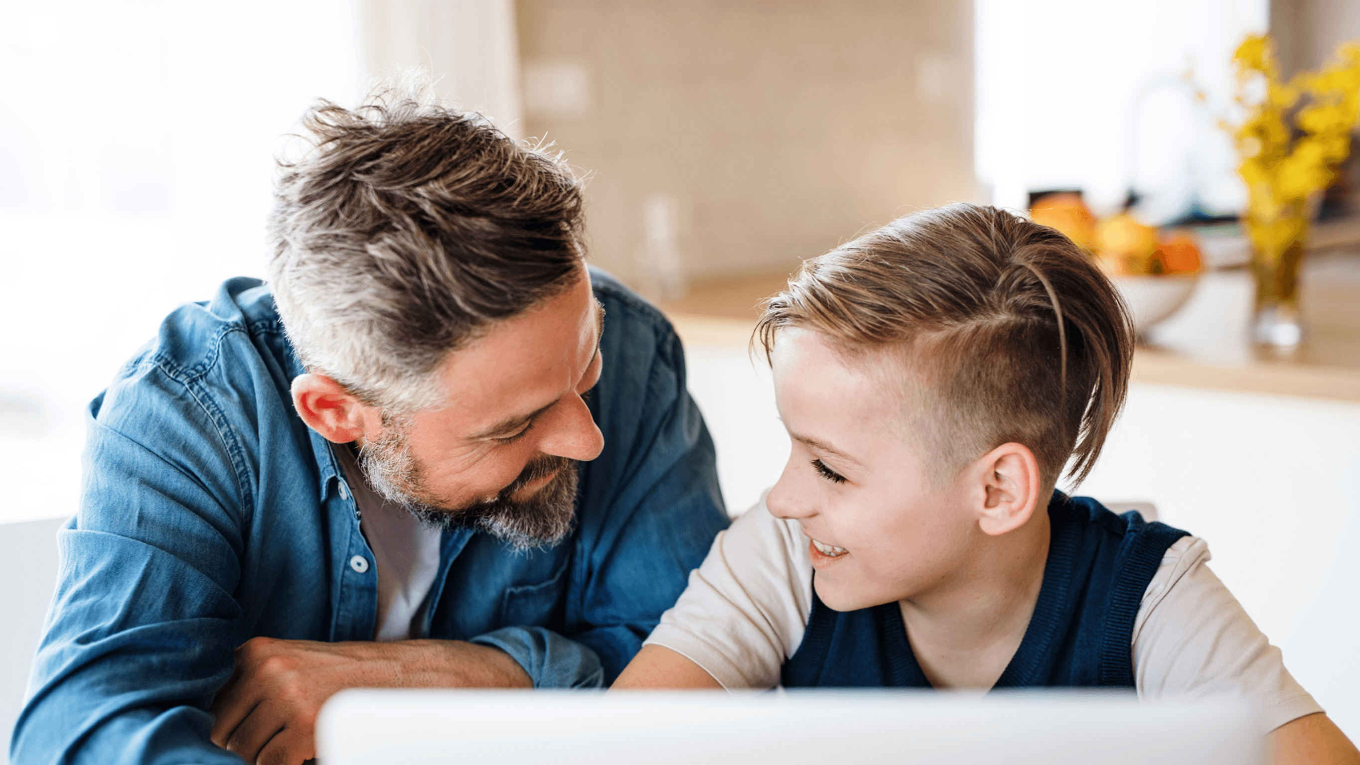 Father and son accessing school announcements and updates on MySchool family portal