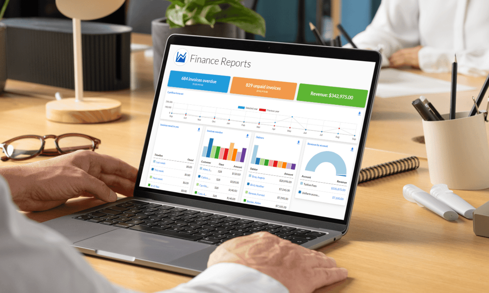 School finance director reviewing MySchool's financial reports dashboard with invoice tracking and revenue data